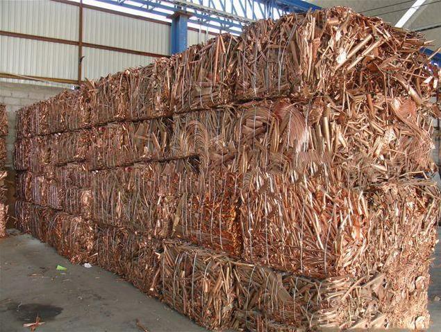 Copper scrap packaged in bundles in a warehouse